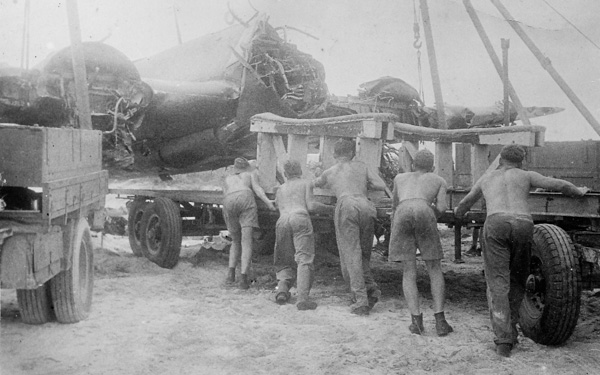 Salvage crew at Morotai airfield retrieving a wrecked Beaufighte